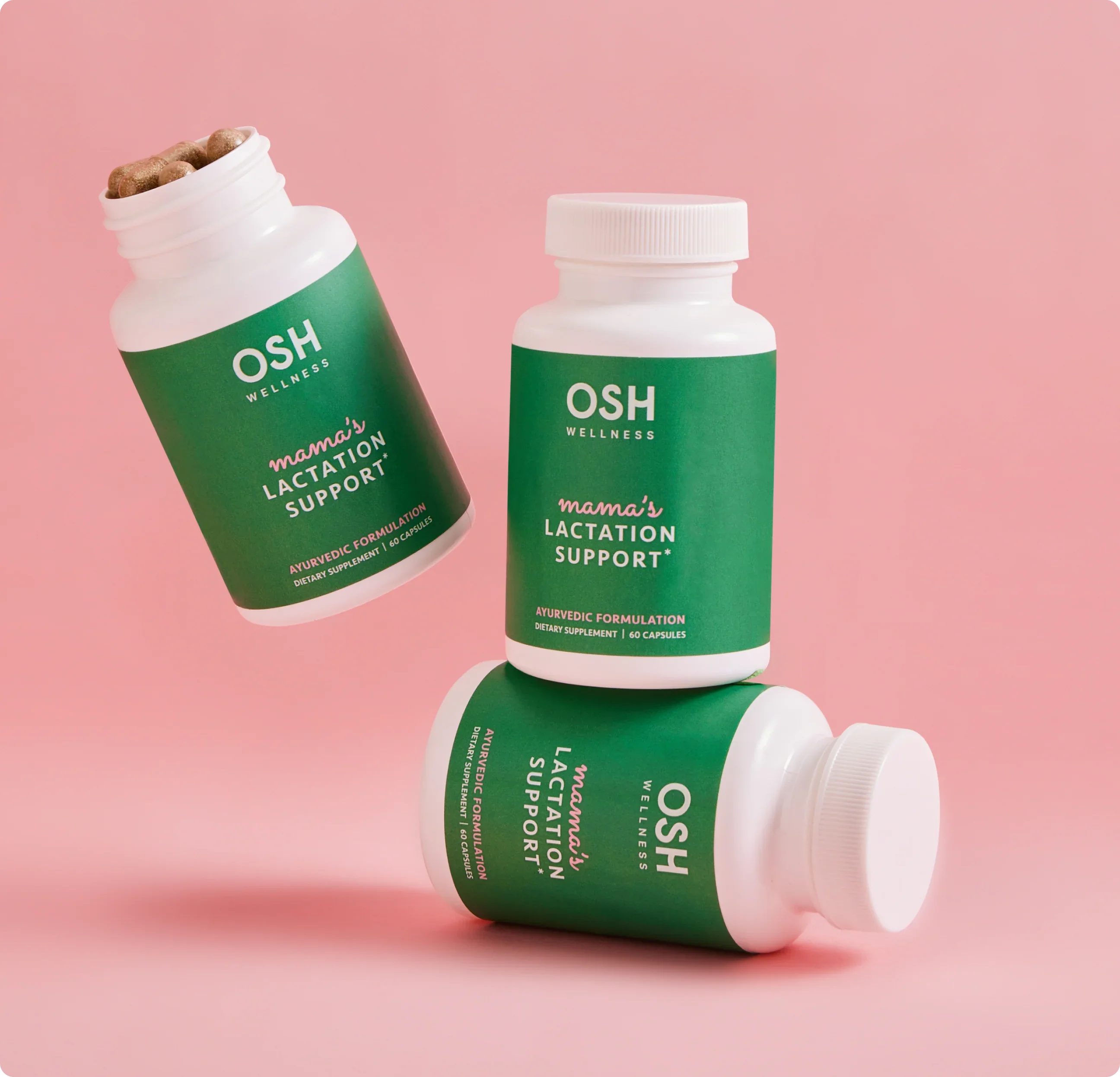 Three white bottles of OSH Wellness mama's lactation support supplements stacked on a pink background.