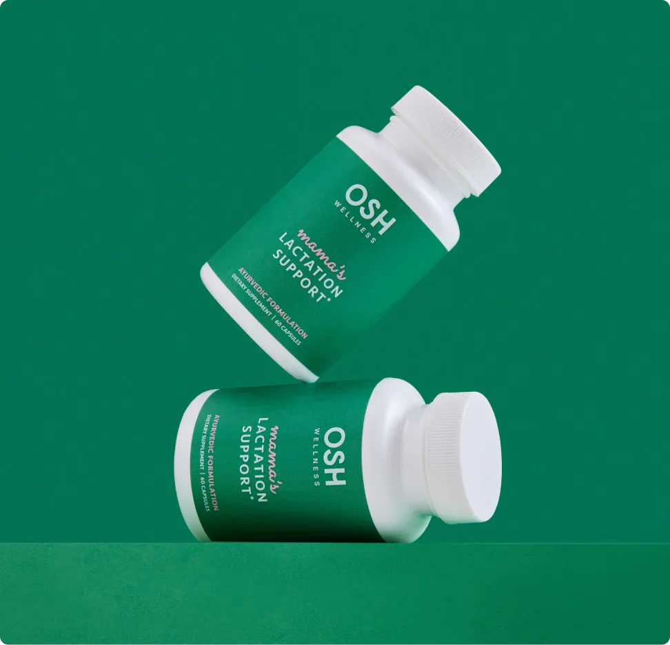 Two green and white bottles of OSH Wellness Mama's Lactation Support capsules.