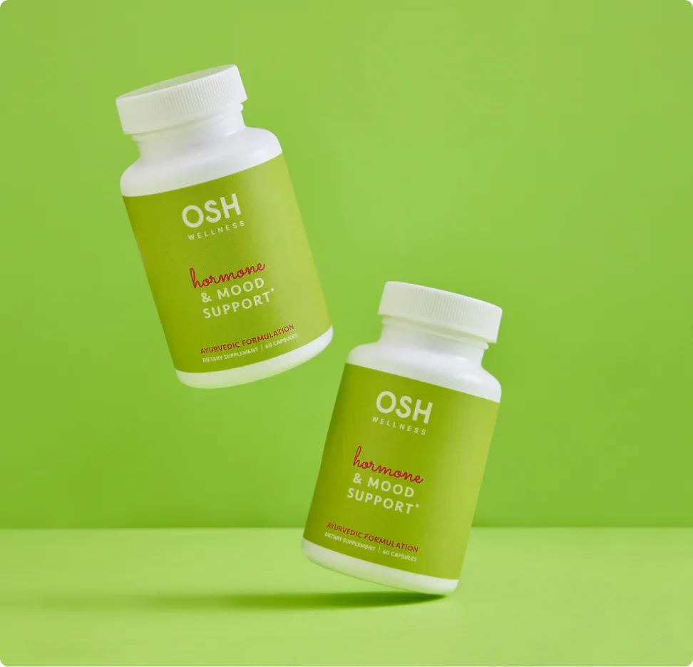 Two bottles of OSH Wellness Hormone & Mood Support supplement on a green background.