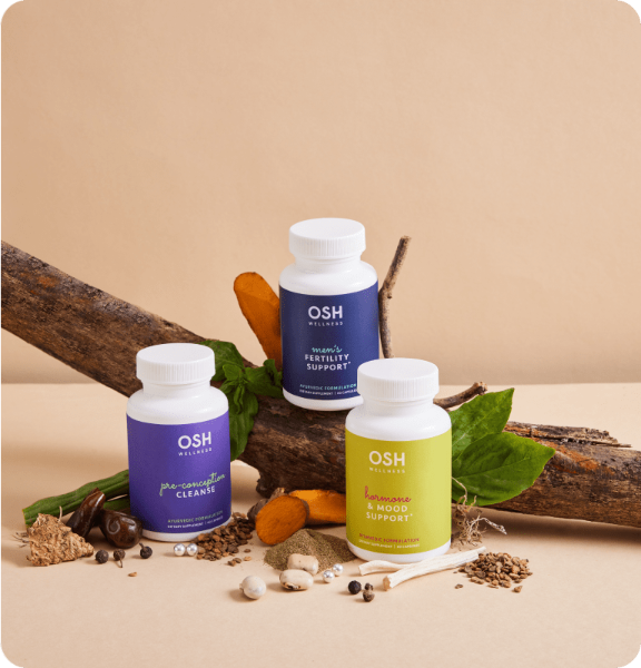OSH Wellness supplement bottles on a natural background with herbs and leaves.