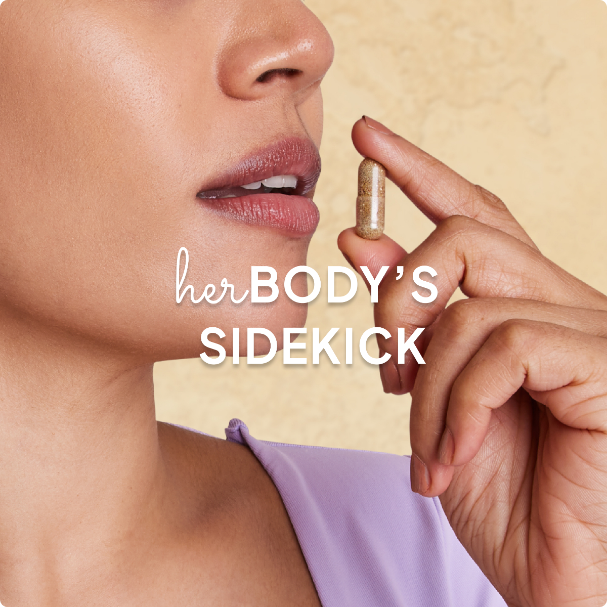 Woman holding a pill of Osh Wellness