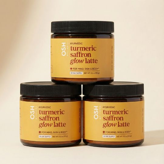 Three jars of OSH Ayurvedic turmeric saffron glow latte on a beige background